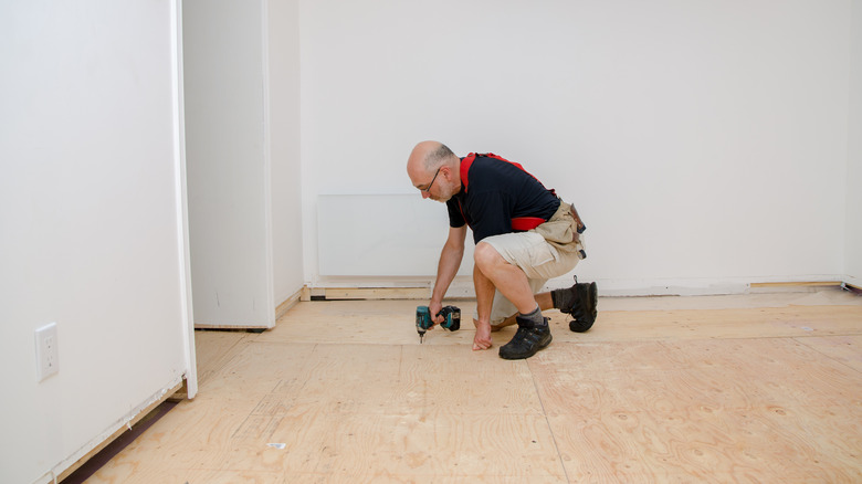 Man installing a basement subfloor