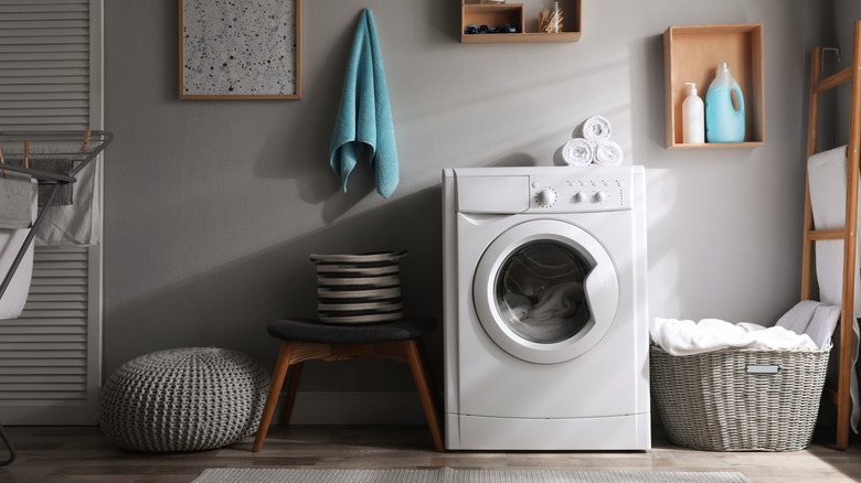 laundry room with lights off and shadows from window