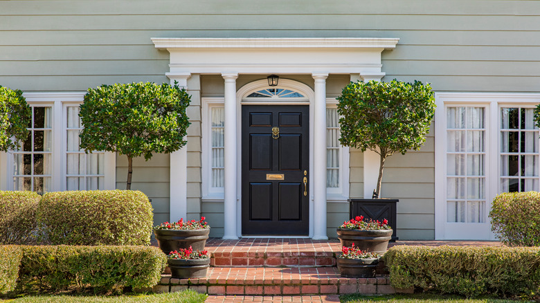 home with black wooden front door