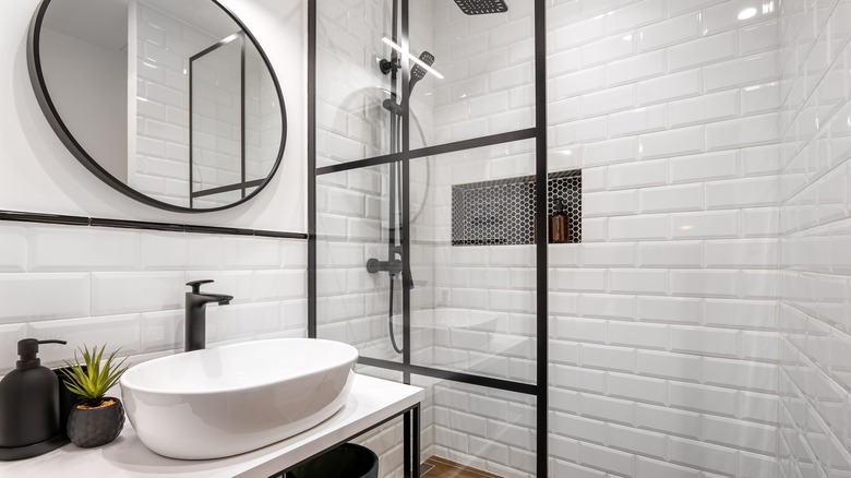 Bathroom with white shower tiles