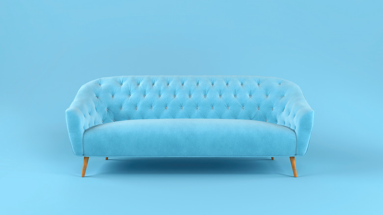 blue couch with blue wall