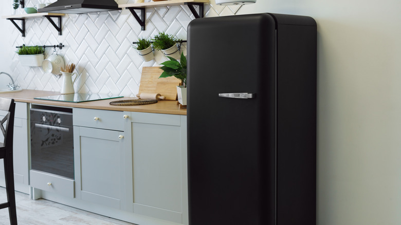 black retro fridge in kitchen