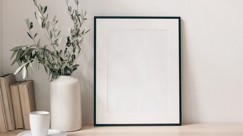 blank frame against white wall