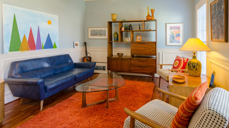 orange area rug in colorful living room