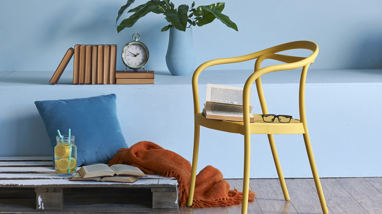 wood pallet table yellow metal chair