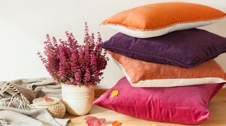 colorful throw pillows and flowers