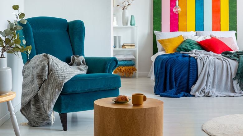 teal wingback chair in bedroom