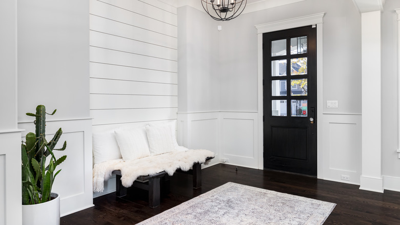 a white shiplap accent wall