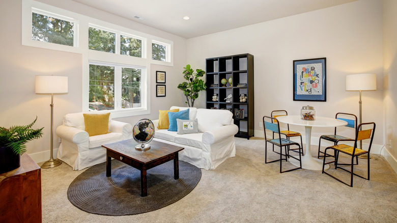 white slipcovers over sofa and chair 