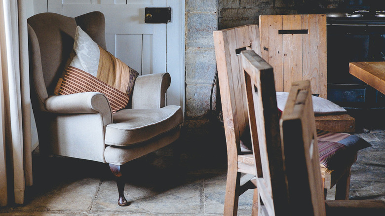 Wooden chairs surround dining table 