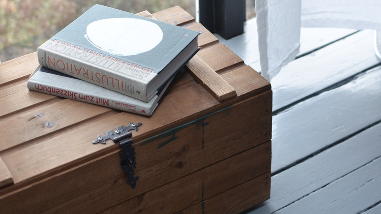 Stack of books on chest