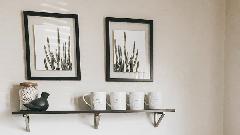 framed cactus posters on wall