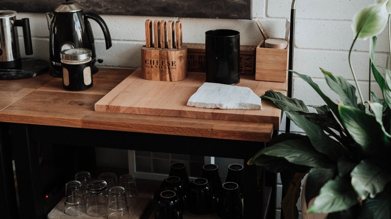 A wooden board coffee station
