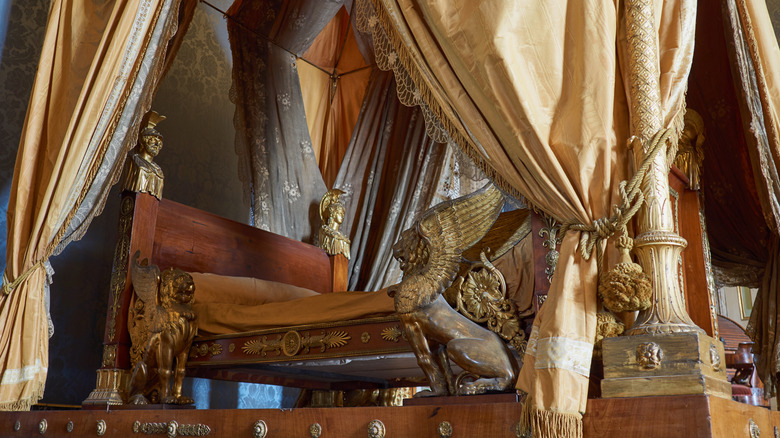 bed with gold and ornate details