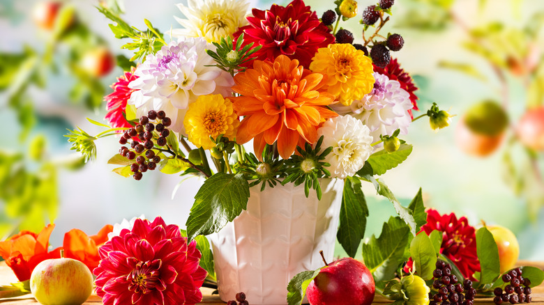 white vase with colorful flowers