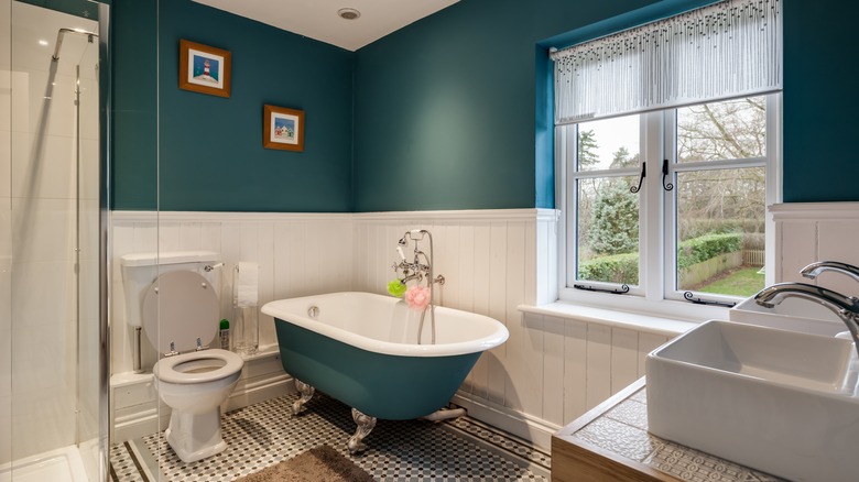 bathroom with dark green walls 