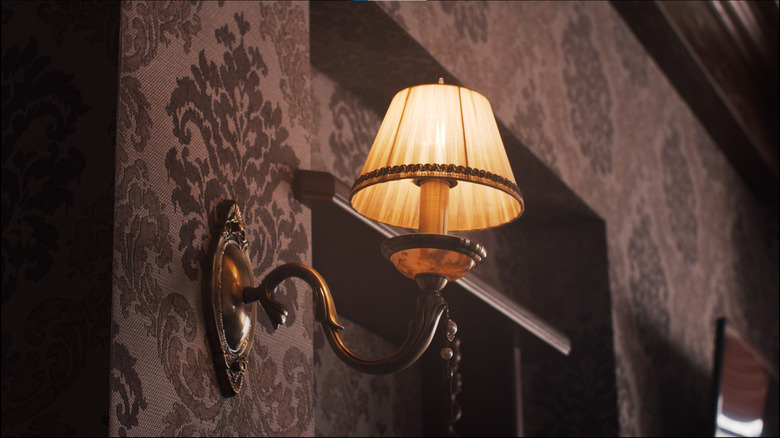 dim wall sconce on wall