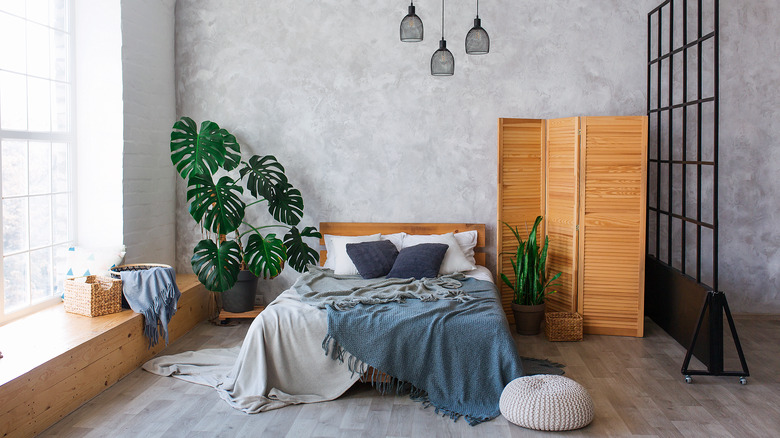 industrial bedroom with blue blanket