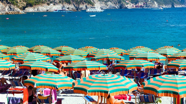 Mediterranean beach with striped umbrellas