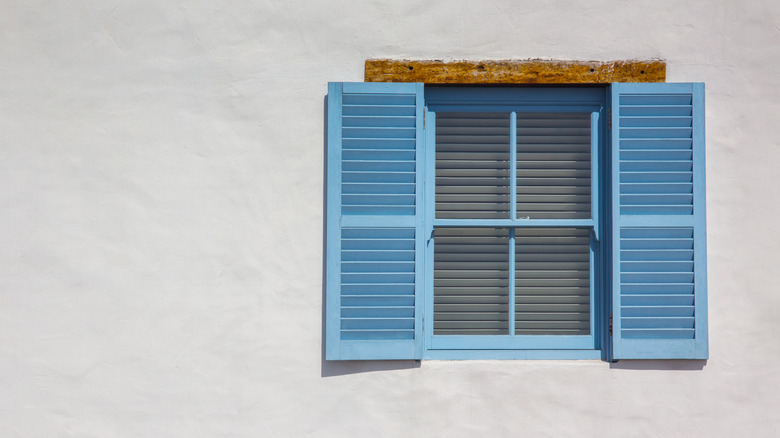 blue window on white walls