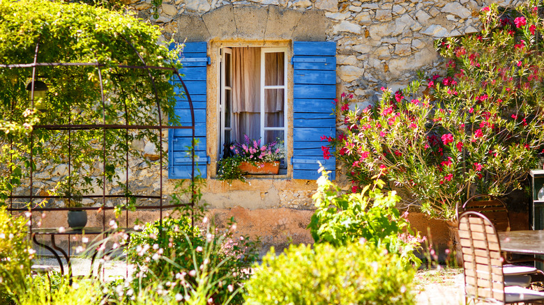 Mediterranean home with blue shutters