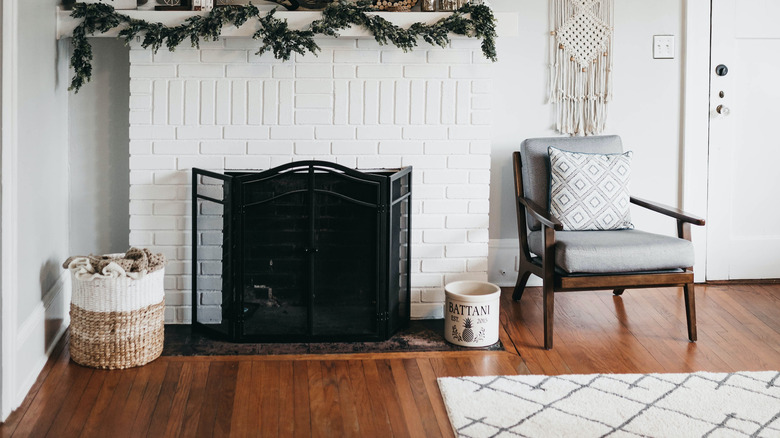 white brick fireplace with basket