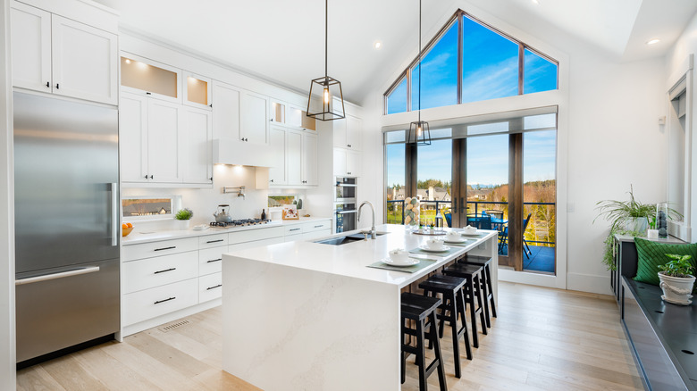 white kitchen with beautiful view