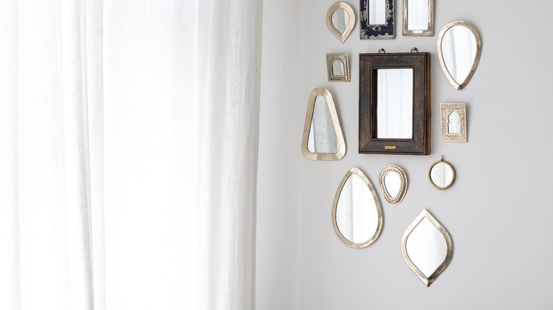 collection of mirrors on wall