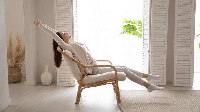 woman relaxing in cozy home