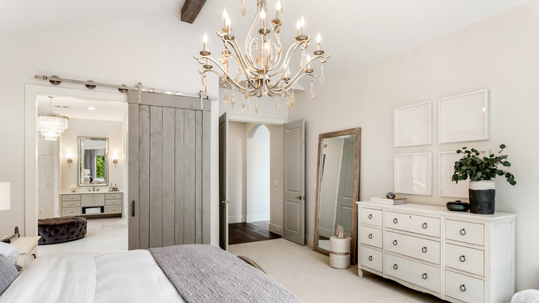 silver chandelier in white bedroom