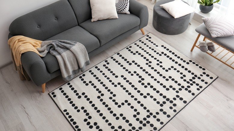 patterned rug next to couch