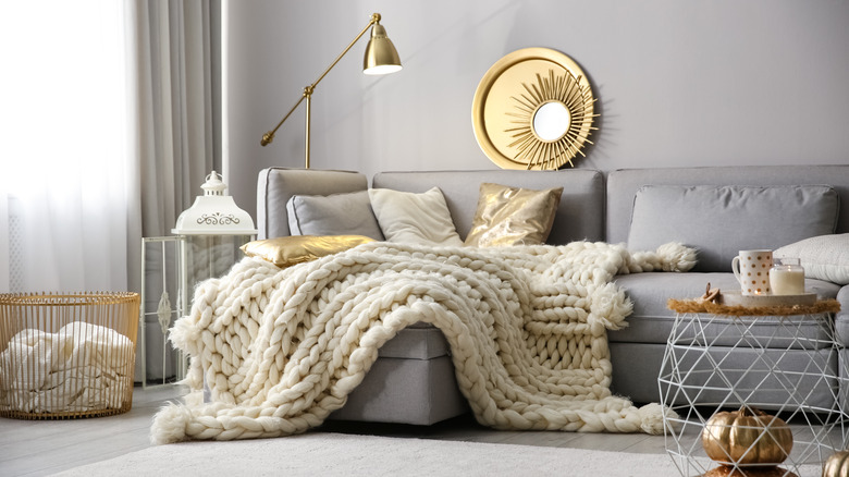 chunky knit blanket on couch