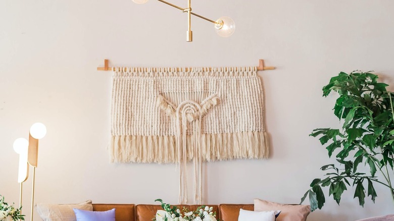 macrame wall hanging with plant