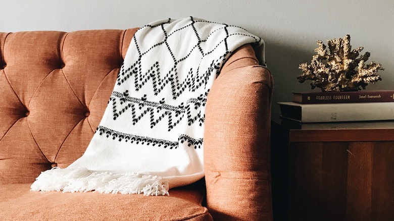 fringe throw blanket on couch