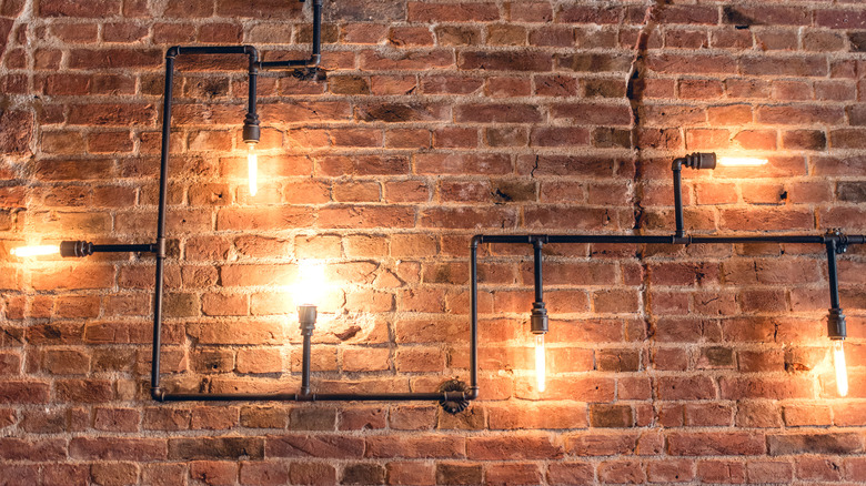 exposed brick with pipe lighting