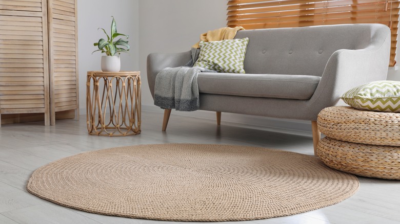 round brown rug with couch