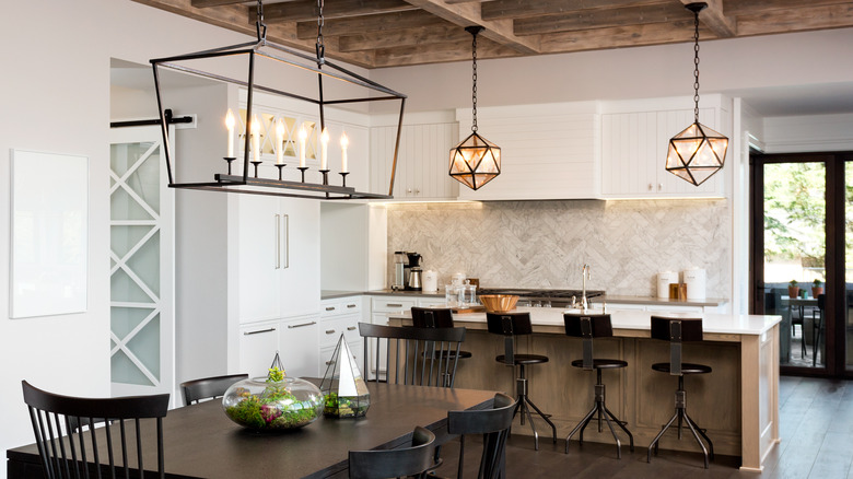 iron chandelier over dining table