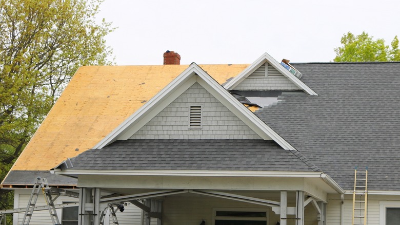 roof decking with shingles being installed