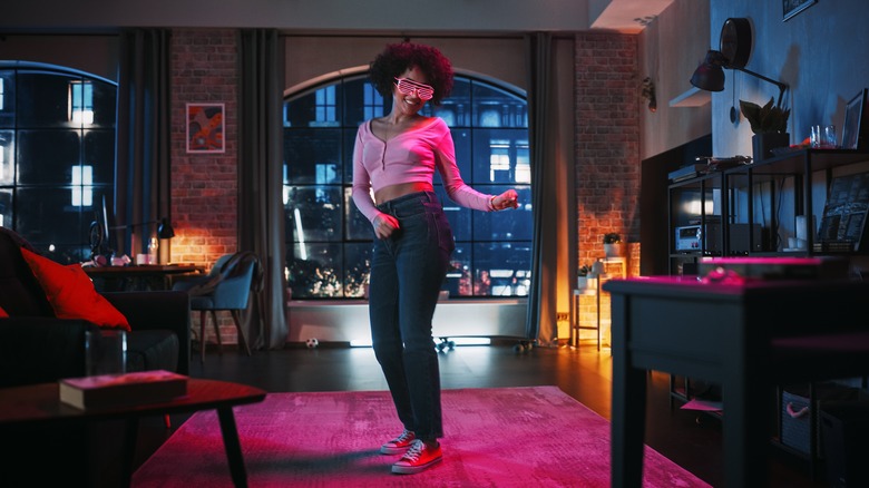 woman in room with color led lights 