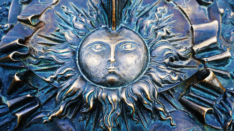 Venetian metal celestial sun design