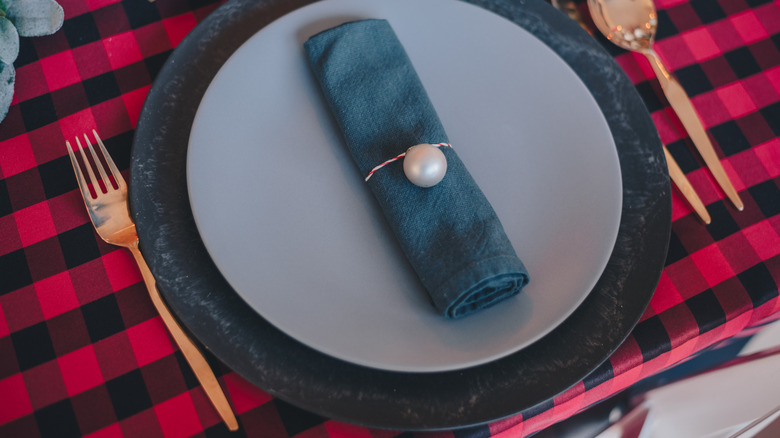 black and red tablecloth with plates