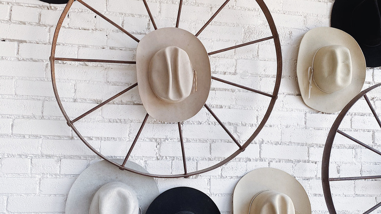 cowboy hats hung on the wall