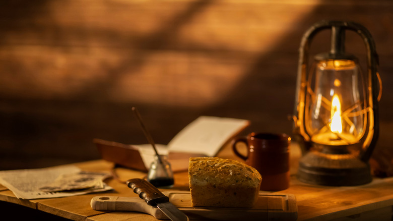 oil lamp with loaf of bread