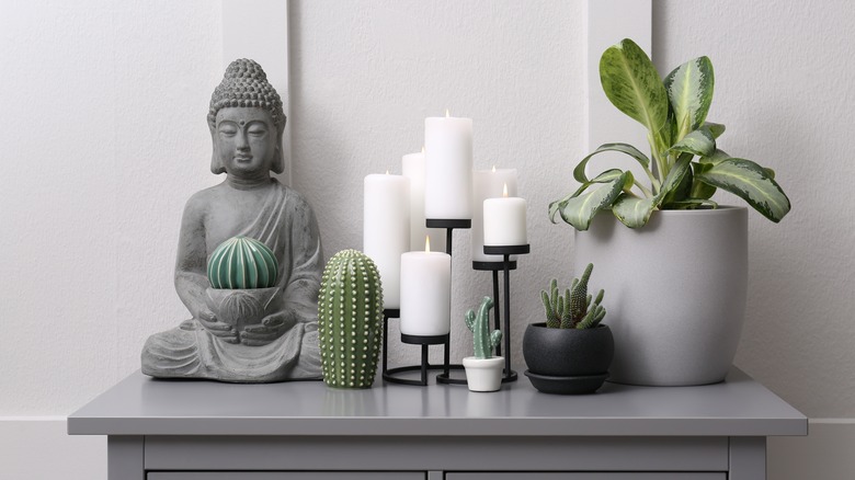 Buddha statue and potted plant