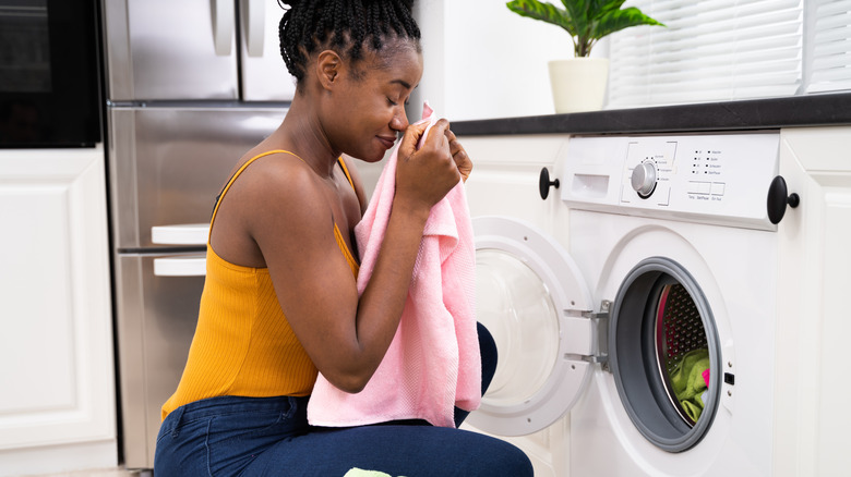 Woman smelling laundry