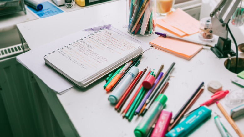 messy pens on desk