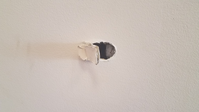 a small hole in dry wall