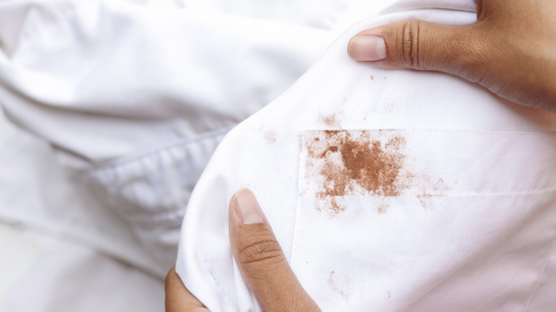 Brown stain on white shirt