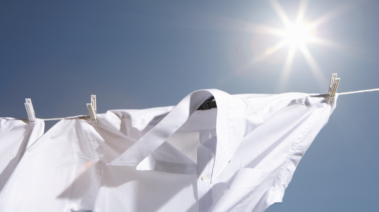 white laundry drying in sun