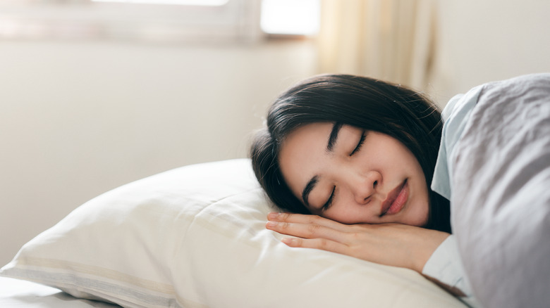 woman sleeping on a pillow